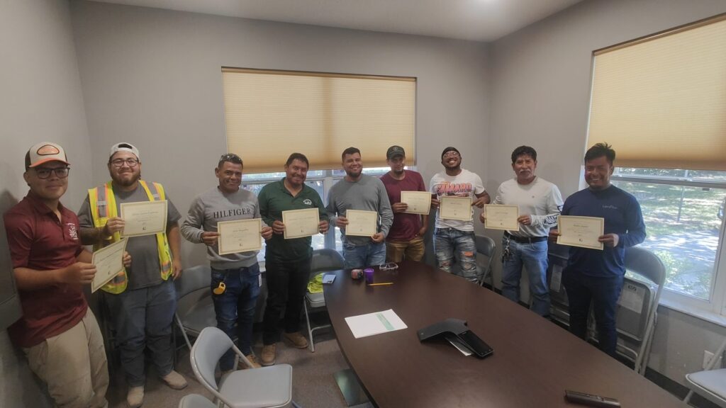 Students holding their certificates