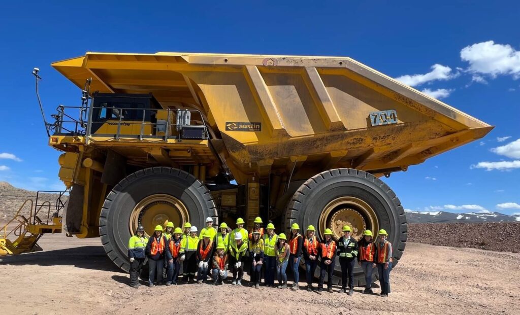 Trained crew in front of a haul truck at a mine site